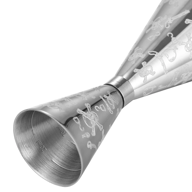 Assorted stainless steel cocktail jiggers for precise drink measurement in different sizes and finishes