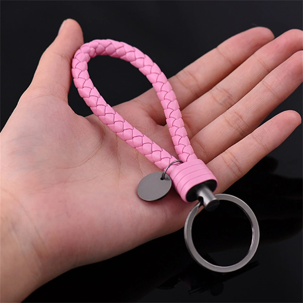 Lifestyle image of keychain on a woman's handbag