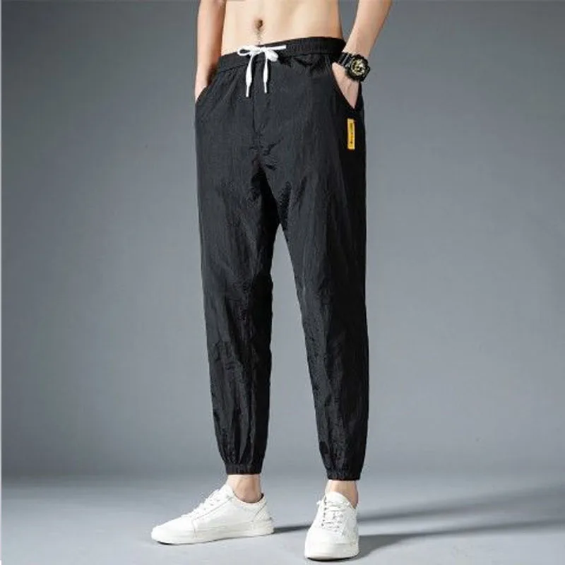 Men Solid Color Elastic Waist Summer Men Breathable Motion Casual Korean Ice Shreds Trend Thin Style Loose Large Size Pants