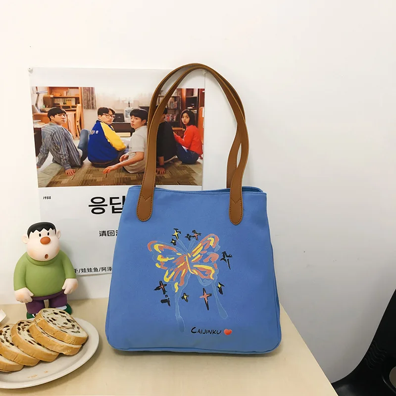 thumbnail image 1 of CGCBAG Bolso de mano de lona informal con capacidad de almacenamiento para mujer, bolso de hombro sencillo para mujer, bolsos de diseñador de moda nuevos de 2024, 1 of 5