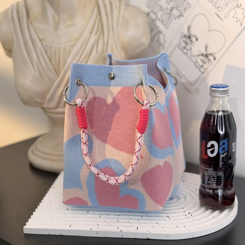 Borsa tote in tessuto grande Capaci Borsa dal design semplice e versatile per donna 2025 Nuova borsa lavorata a maglia con fiore scavato