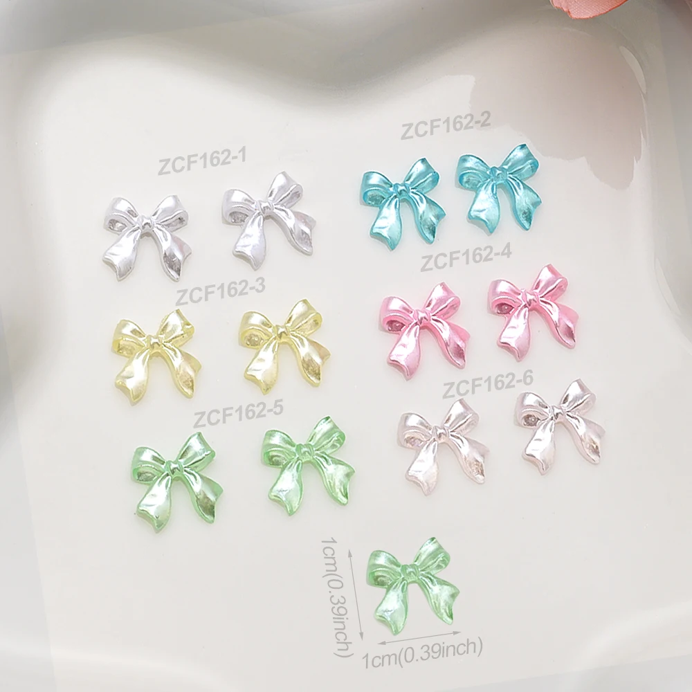 100Pcs 진주 흰색 광택 리본 활 네일 아트 매력 3D 우아한 Kawaii 수지 Bowknot 여름 네일 장식 매니큐어 Accessorie