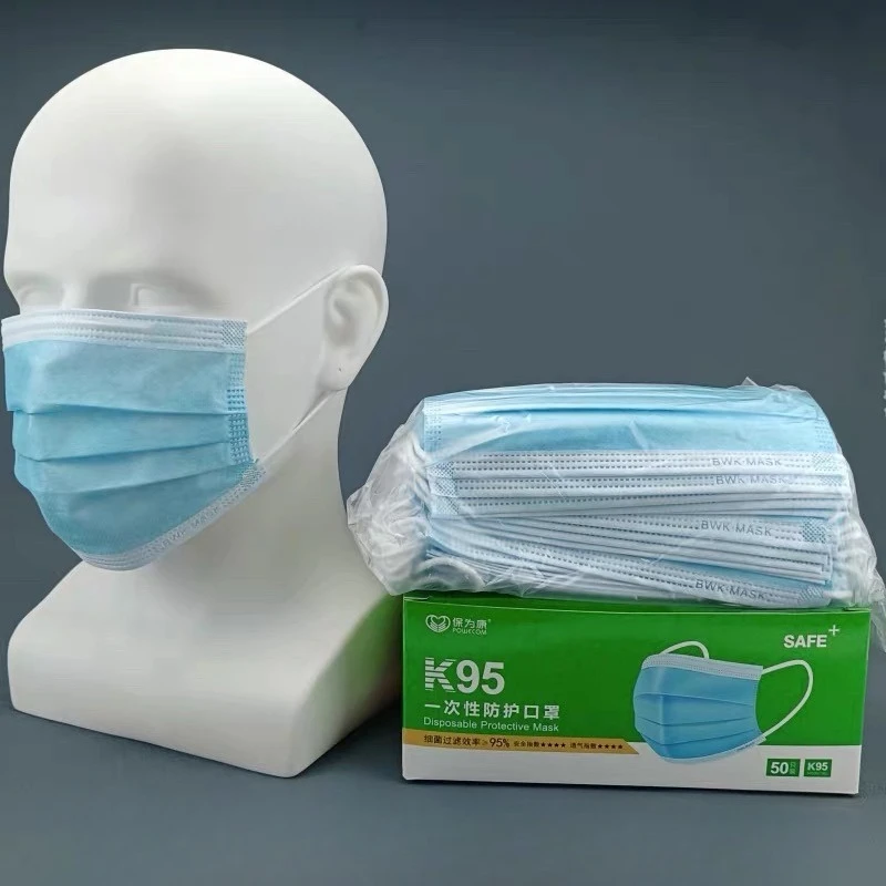 Paquet scellé de 50 masques jetables au charbon actif, étiquette visible, protection formaldéhyde incluse.