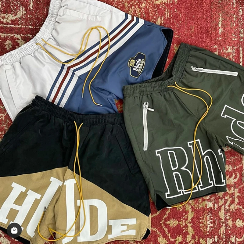 

Rhude Retro Letter Logo Print Two-color Stitching Drawstring Shorts Best Quality Men Women Camel Black Shorts Men Shorts