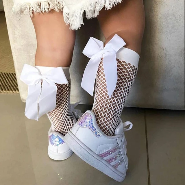 Chaussettes hautes blanches avec noeud pour petite fille