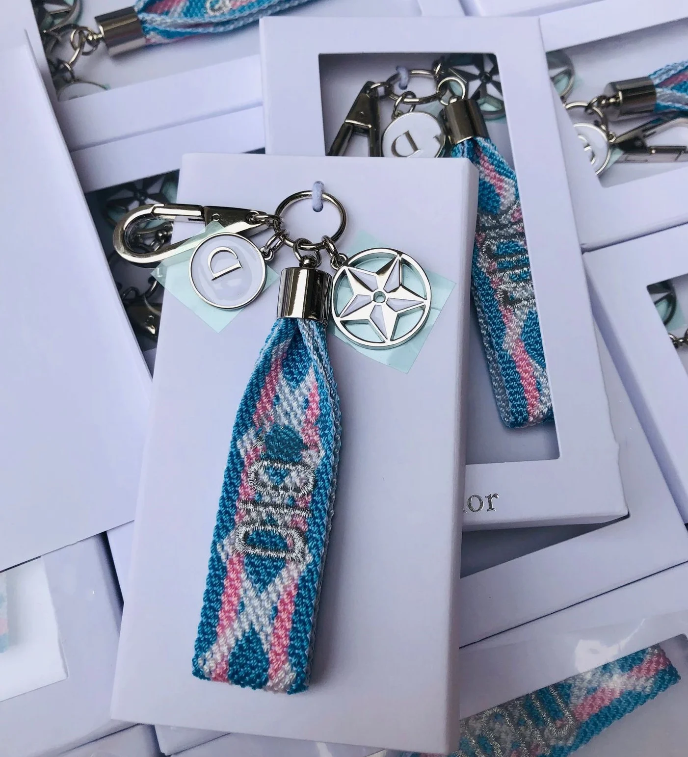 

European and American woven embroidered blue keychain