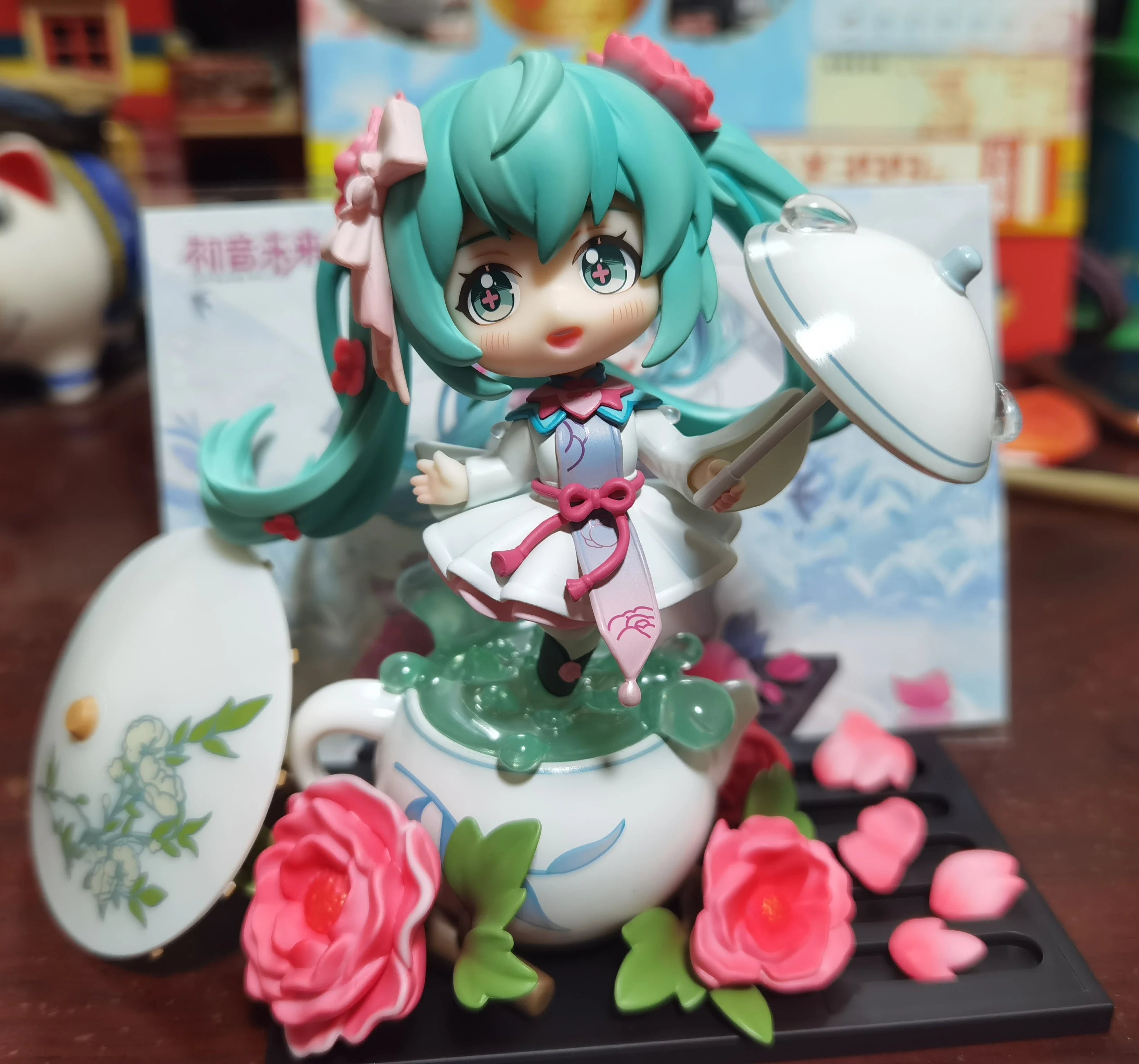 

Original Hatsune Miku Anime Figure Vocaloid Flowers Weave In Rain Q Version Model Collectible Action Figurine Toys Birthday Gift