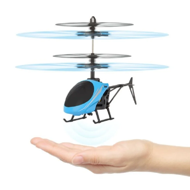Mini drone hélicoptère enfant avec lumières LED allumées posé sur une table