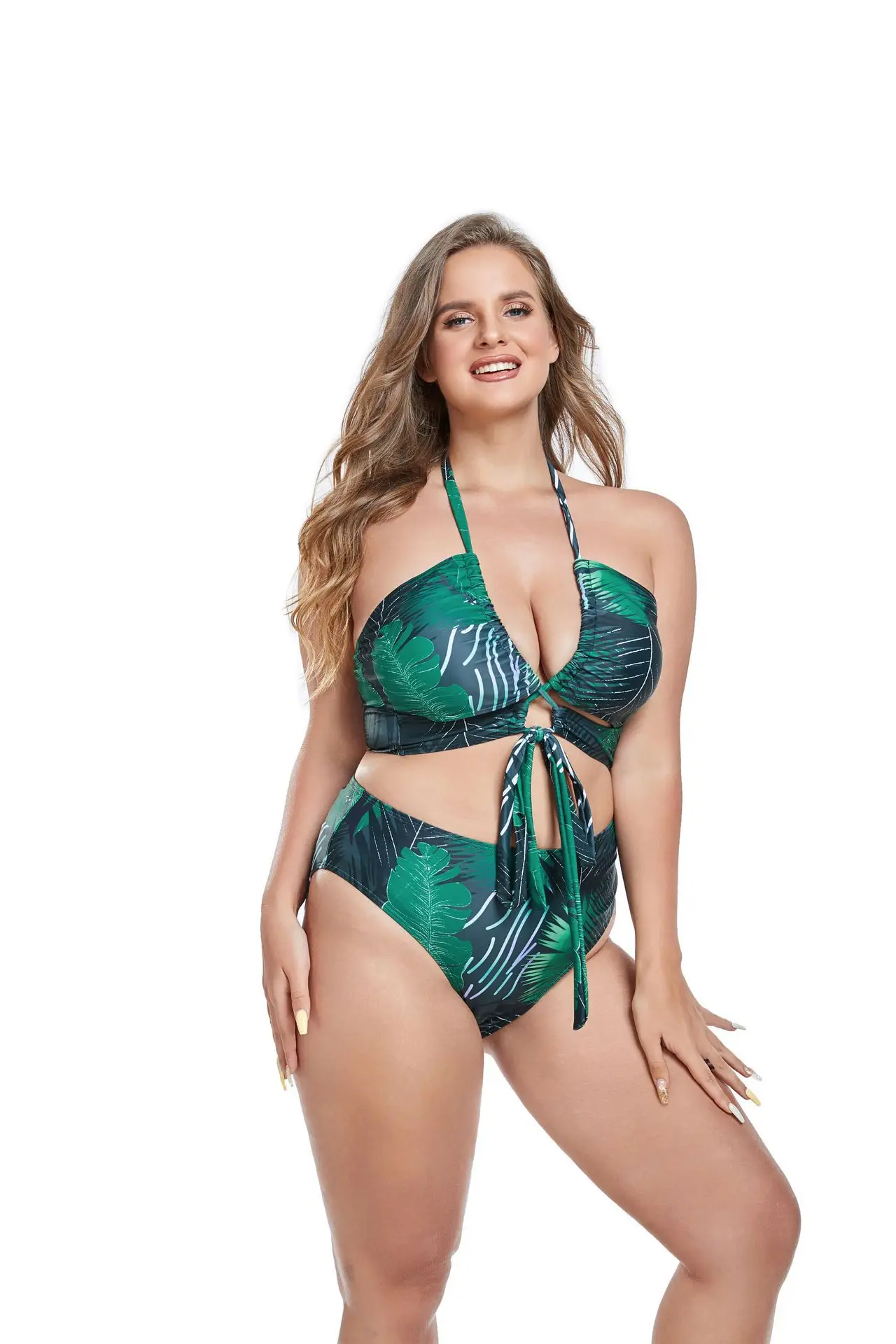 Close-up of printed swimwear fabric with green leaf pattern and soft summer finish