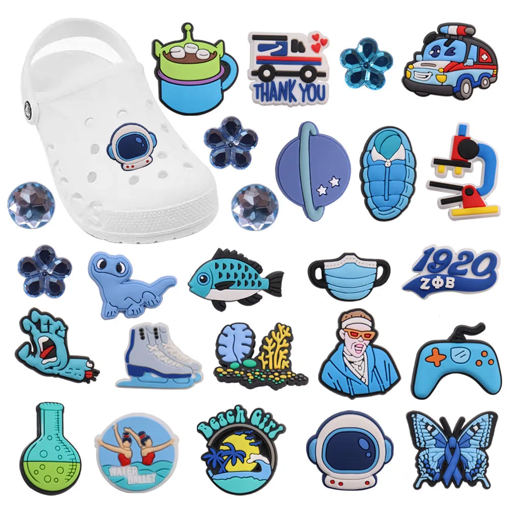 

Mix 50PCS PVC Croc Jibz Buckle Butterfly Car Coral Skates Planet Ambulance Beach Sleeping Bag Fish Decorations for Bands