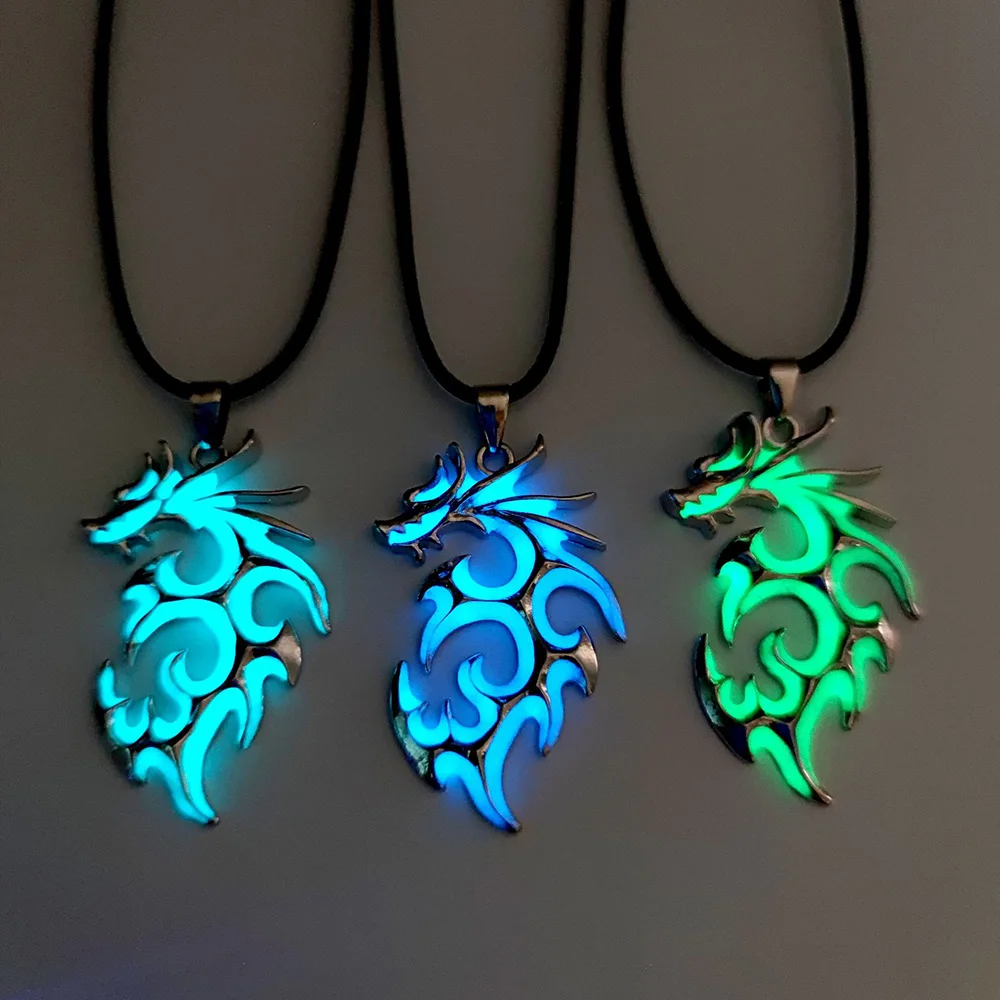 Three Luminous Dragon Necklace Glow In The Dark necklaces on a black background.