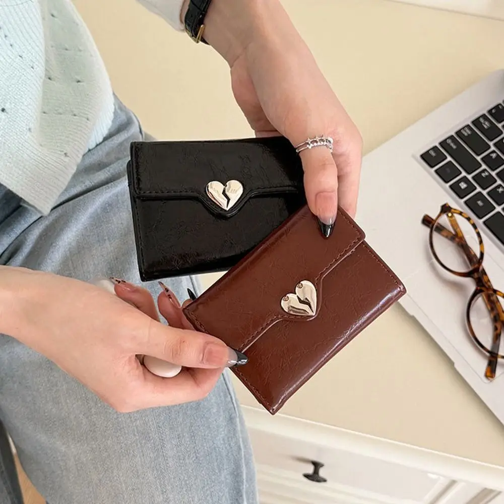 Portafoglio portatile coreano a forma di cuore con crepa Portafoglio in pelle da donna di alta qualità in pelle PU Piega borsa da studente corta da donna