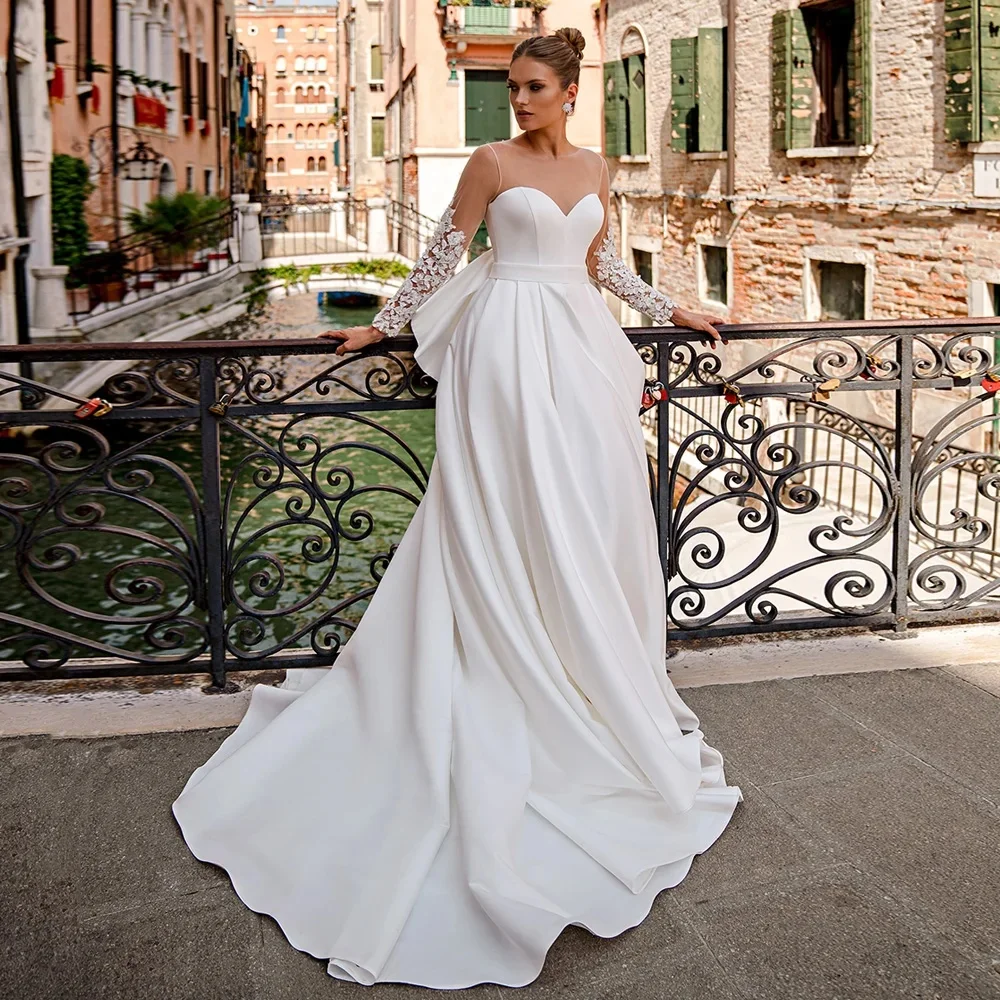 

2024 Elegant Satin Wedding Dress for Bride Sheer Long Sleeves Round Neck Applique Back Big Bow Corset Bridal Gown A Line Design