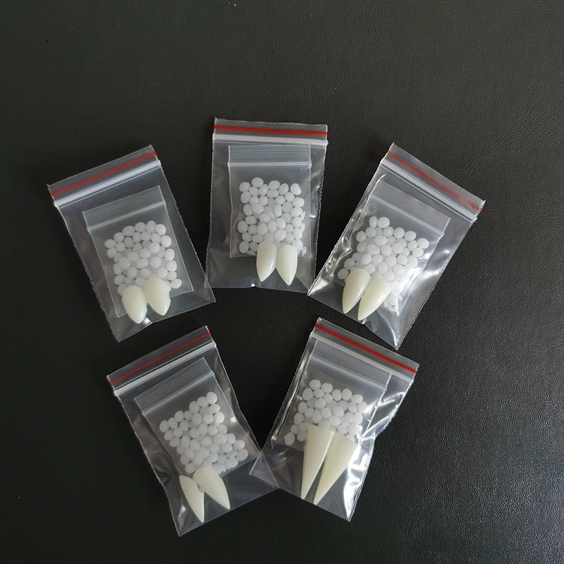 Spooky Halloween Vampire Teeth Decoration Kit with Resin Fangs and Adhesive - Perfect for Cosplay and Witchy Decor