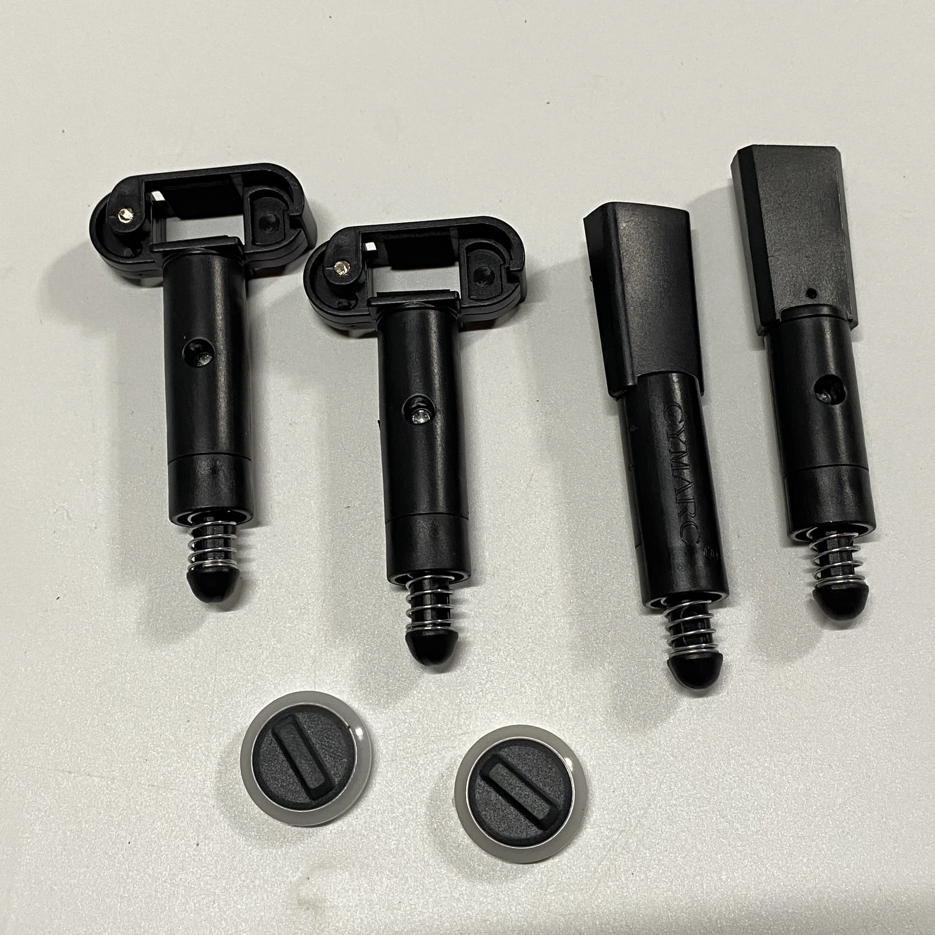 Amortisseur pour drone SJRC F22S, pièce cylindrique noire avec ressorts.