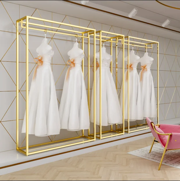 Estante de exhibición de alta gama para vestidos de boda, colgador de ropa de hierro montado en el suelo, dorado, estudio