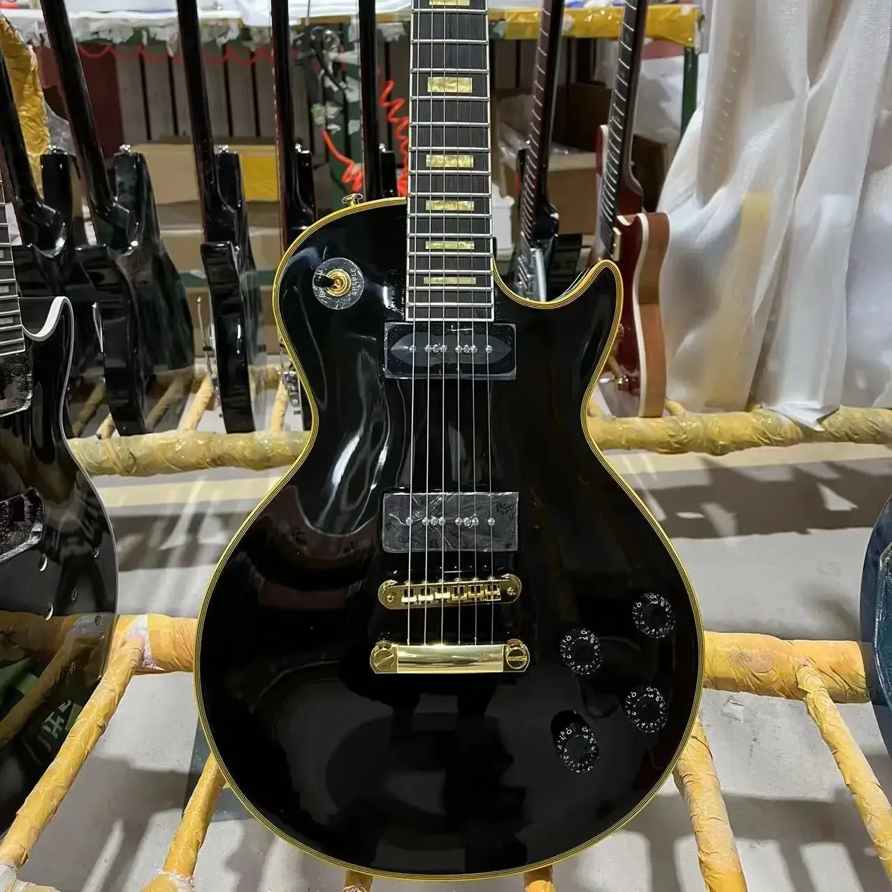 

Custom Electric Guitar, Black Color, Mahogany Body, Rosewood Fretboard, Golden Hardware, Yellow Binding, Free Shipping