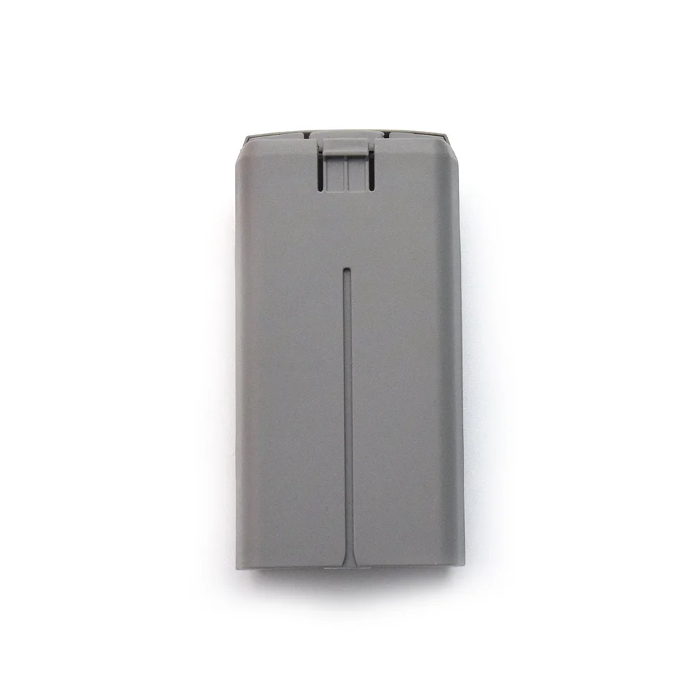 Batterie de vol intelligente insérée dans un DJI Mini 2, prête pour le décollage.