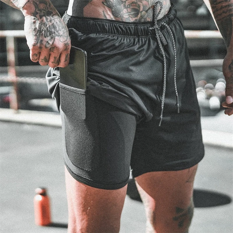 

Classic double 2-in-1 men's shorts multifunctional fashion fitness pants tight inside and loose outside anti-exposure shorts.