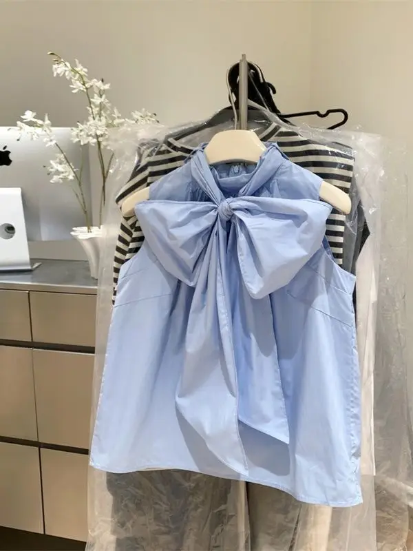 بلوزة بيضاء للنساء 2026 Blusas Mujer قمصان فضفاضة بدون أكمام بفيونكة على الموضة بلوزات صيفية حلوة للسيدات