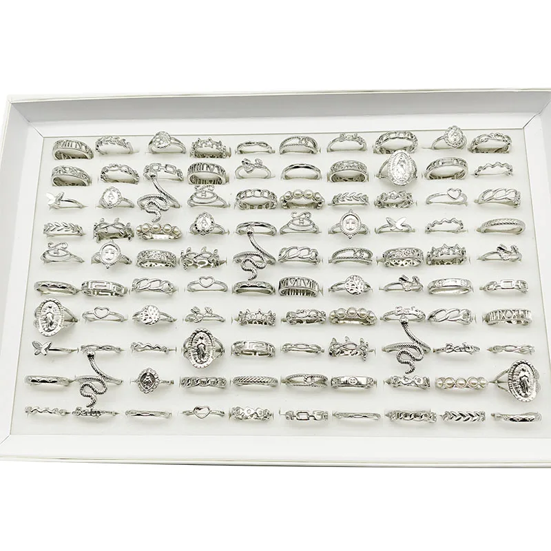Assortment of thin gold colored rings for versatile finger adornment