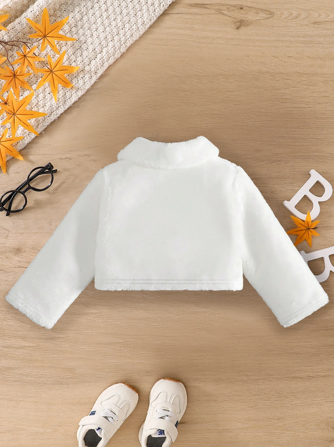 Jacket detail showing fabric and button