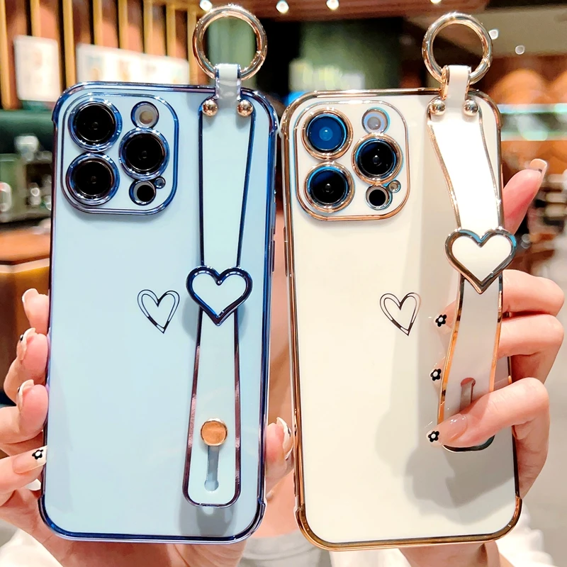 Funda con correa de muñeca chapada en corazón de amor suave para iPhone