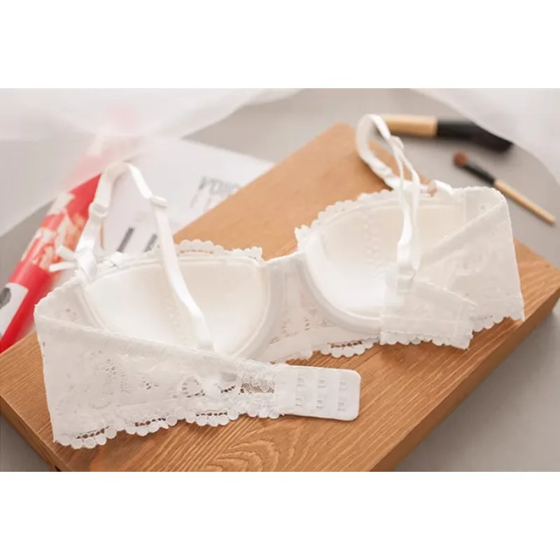 Full display of red lace lingerie set laid flat