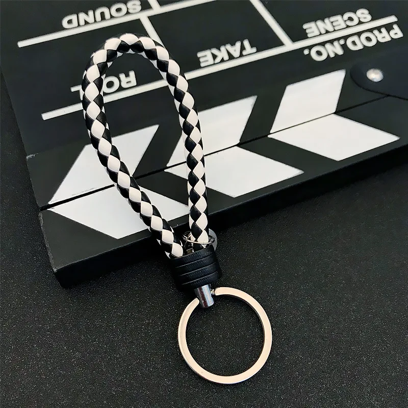 Wholesale Creative hand woven leather rope keychain cute doll pendant