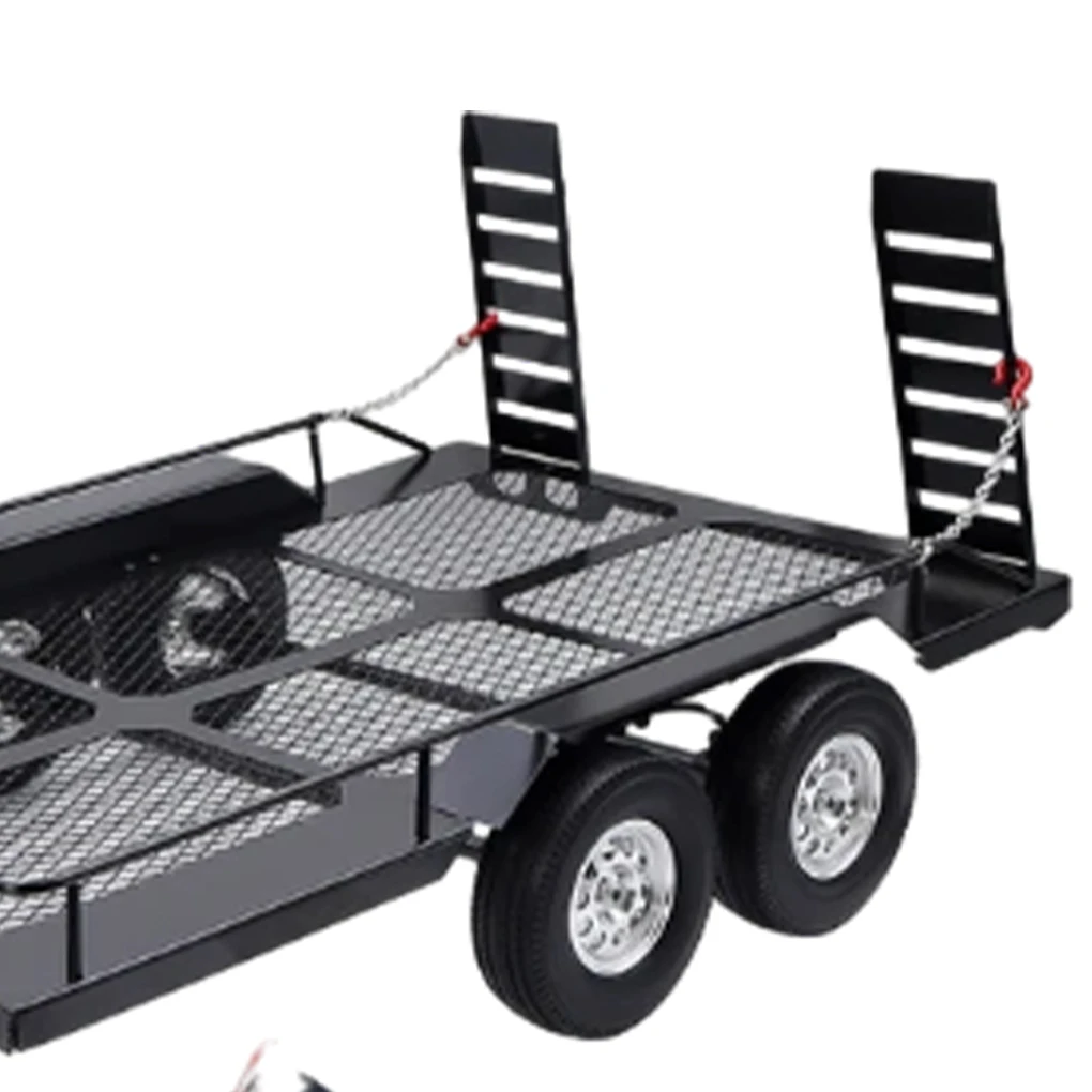 Remorque RC en métal pour crawler avec roue de secours, vue latérale.