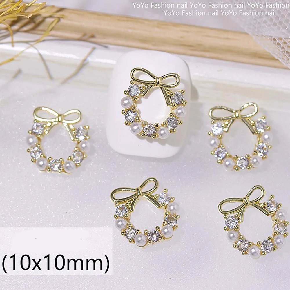 10Pcs 크리스마스 럭셔리 합금 갈 랜드 Bowknot 네일 아트 장식 10*11mm 3D 지르콘 진주 네일 매력 DIY 바로크 갈 랜드 네일 부품