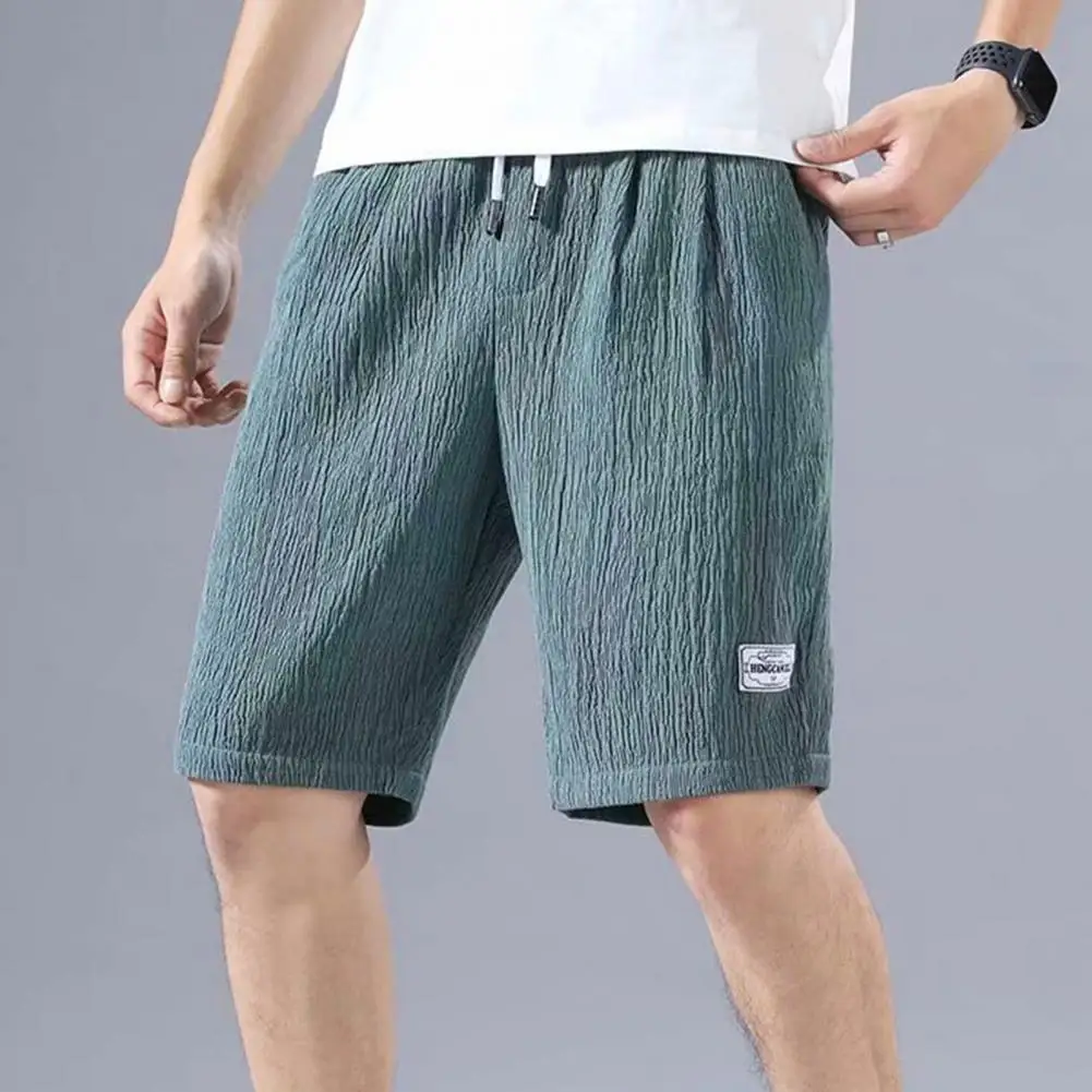 

Шорты мужские спортивные быстросохнущие, шелковые с кулиской на талии и карманами, широкие штаны для активного отдыха, лето