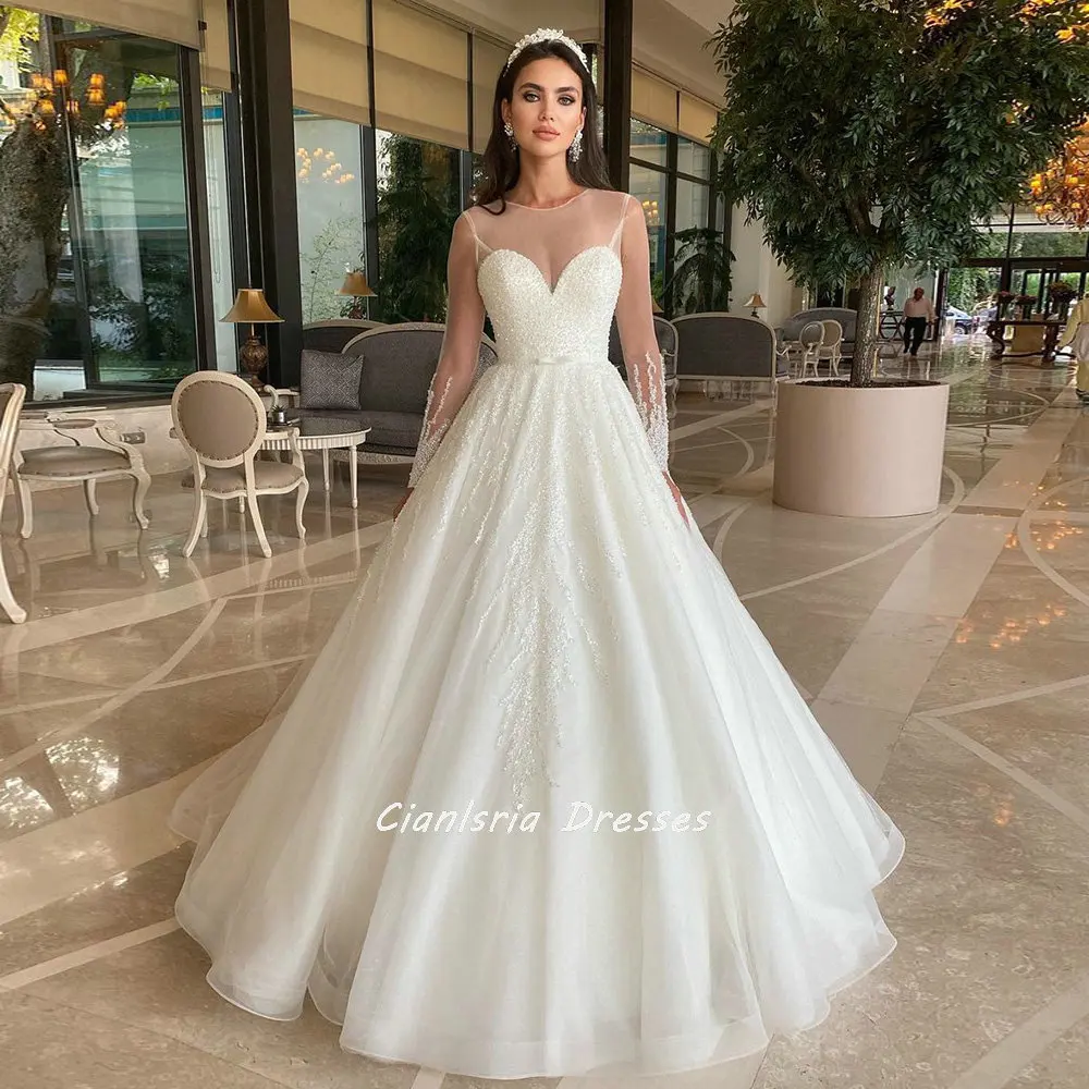 

Charming Beading Pearls Illusion Back Dubai Wedding Dress Ball Gown O-Neck Long Sleeve Crystal Saudi Arabic Bridal Gowns