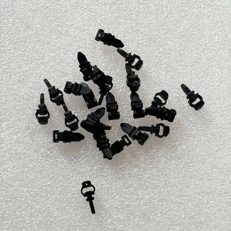 Pack de 4 amortisseurs caoutchouc pour cardan DJI Mavic Mini, disposés en éventail.