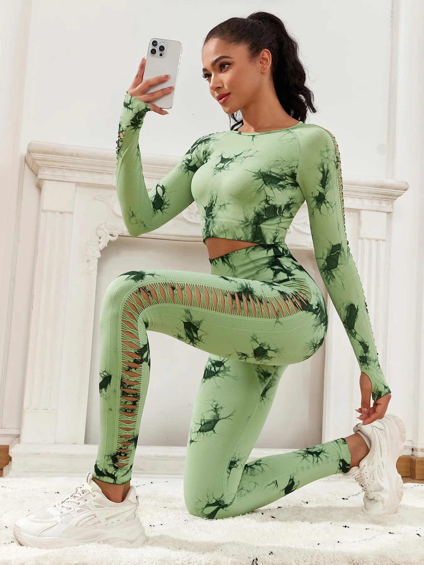 The side view of a woman the Sexiest Women's Workout Clothes in green tie dye sold by 100 Spartans