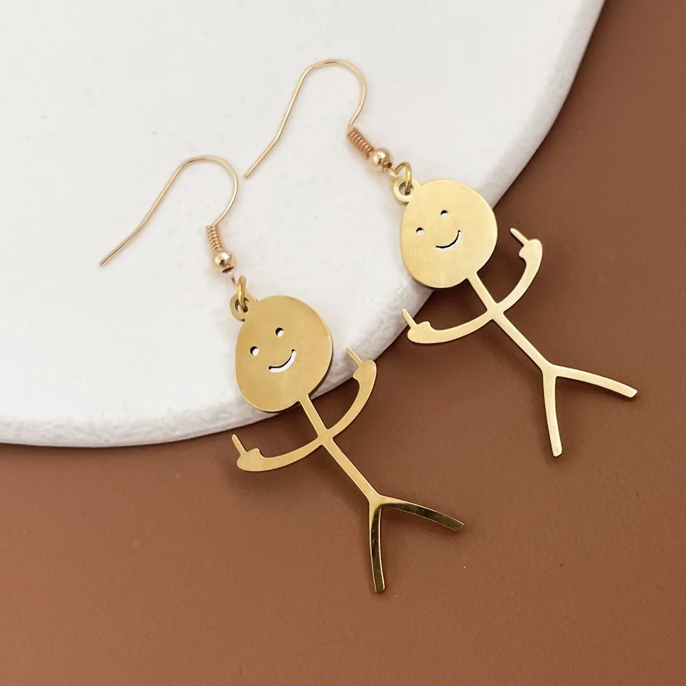 A pair of gold dangle earrings with the Creative Doodle Pendant Earrings, featuring a stick figure, creatively doodled.