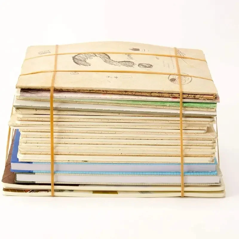 rubber bands stored inside a clear container on a desk