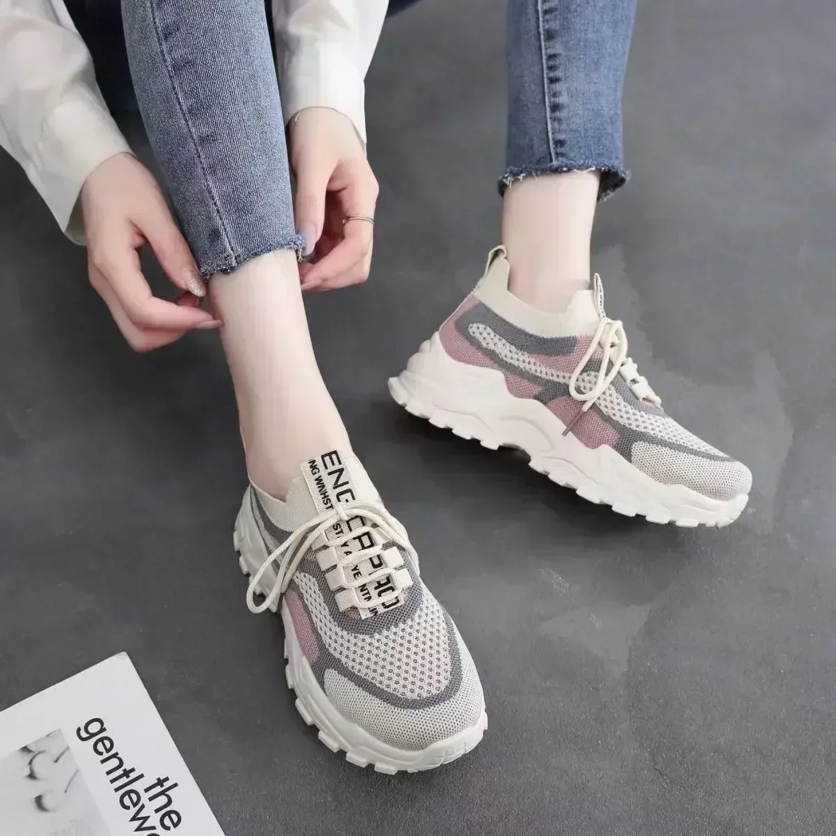 A pair of trendy thick-soled red mesh sneakers with a breathable woven design, perfect for casual wear and light running 07