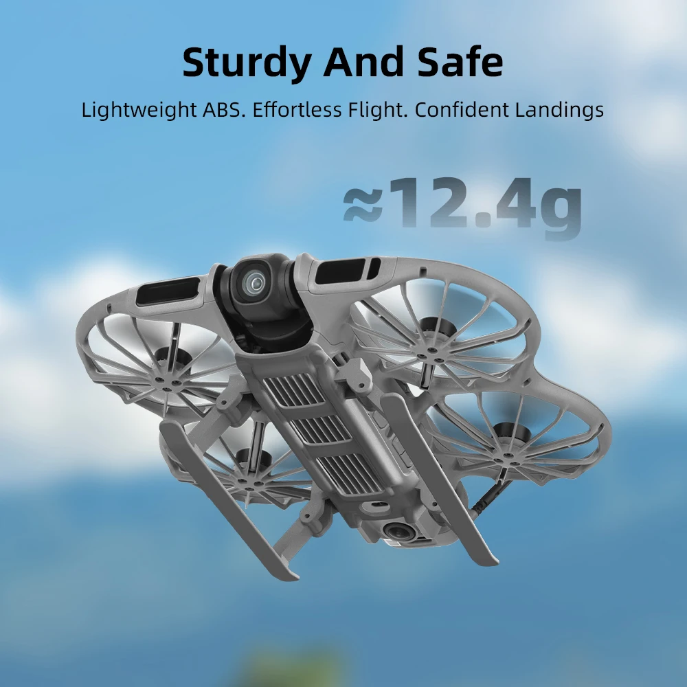 Drone DJI Mini 3 Pro équipé du train d'atterrissage pliable, posé sur herbe, illustrant la protection accrue du dessous.