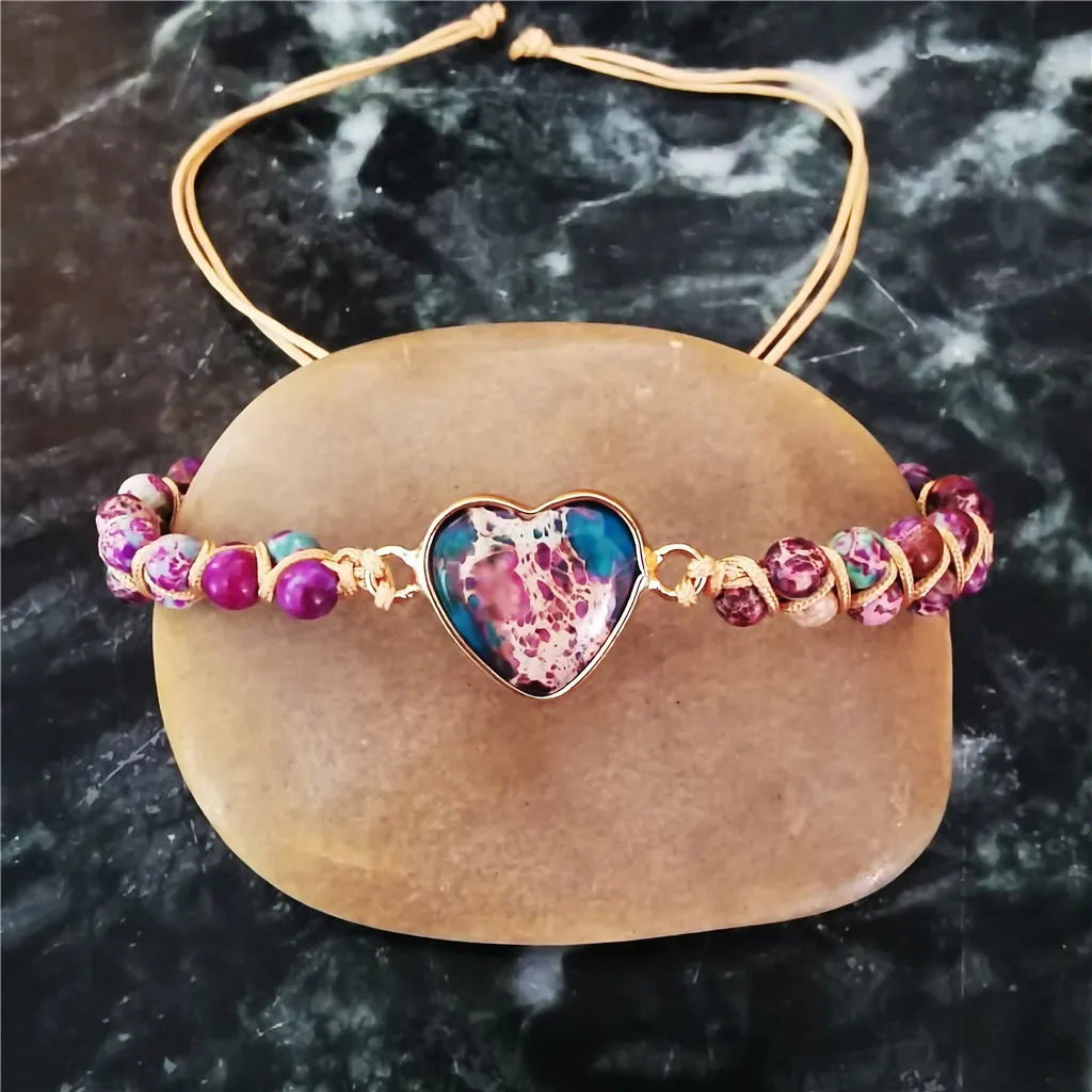 Heart charm bracelet with pink, blue, and brown stones
