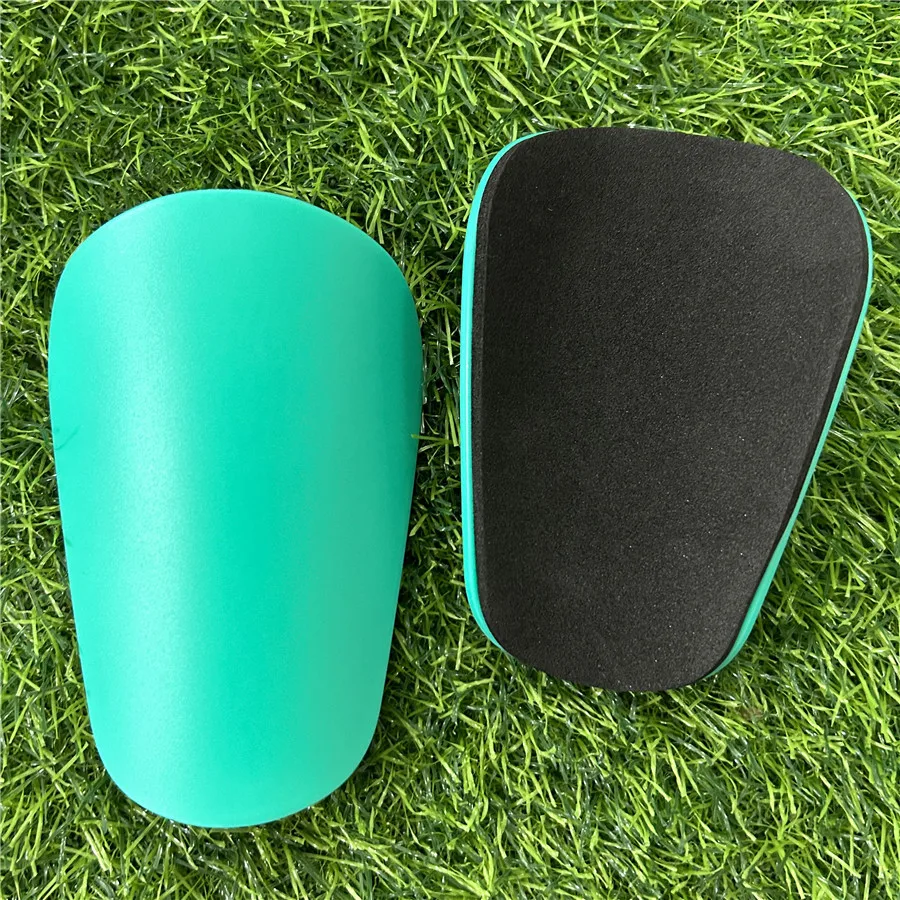 thumbnail image 1 of 1 par de mini espinilleras de fútbol resistentes al desgaste, protectores de piernas que absorben los golpes, livianos y portátiles, para entrenamiento de fútbol, 1 of 5