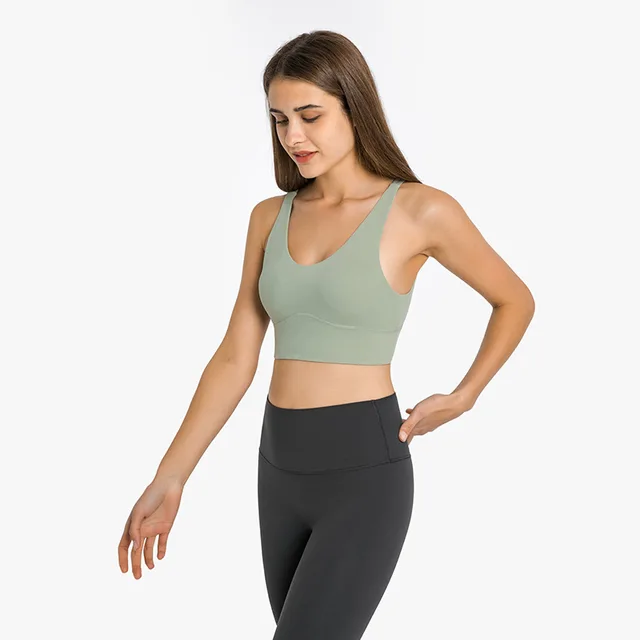 NWT Sexy Deep V Neck Training Gym Sports Bra is a stylish and comfortable sports bra with a deep V neck and back cross strap design. It is made with breathable and quick-dry fabric, ensuring a comfortable fit for yoga and gym workouts. Free shipping available. Rated 5/5 by satisfied customers.