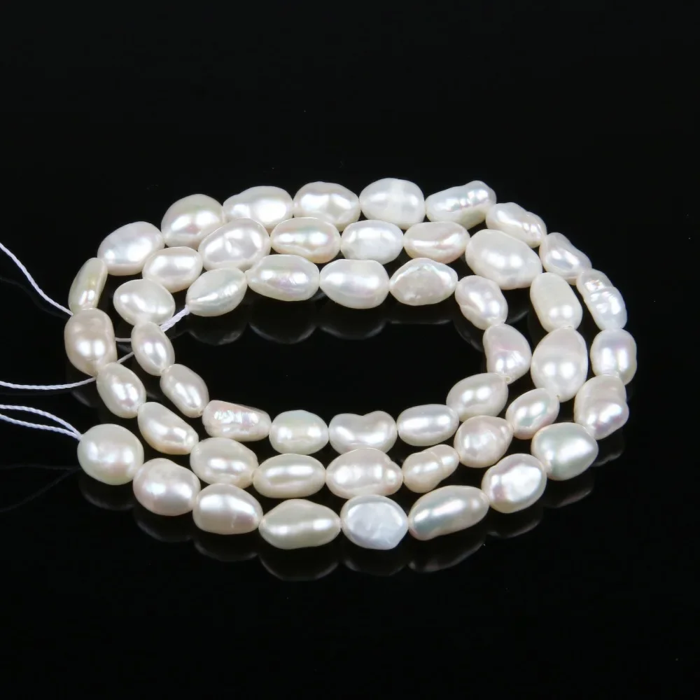 String of white pearls on a black background
