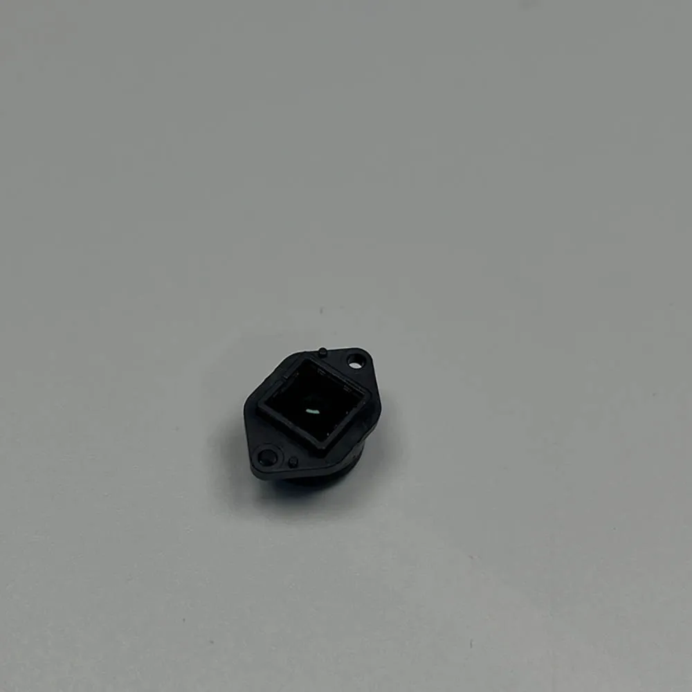 Huit pièces de capteurs lentilles gris clair pour drone, présentées en vrac sur fond neutre.