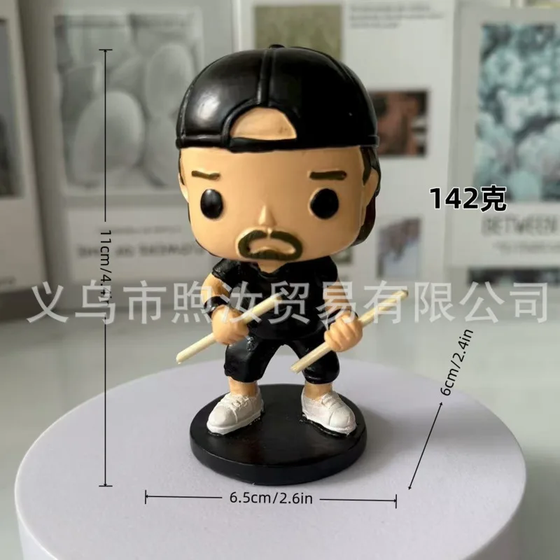 Mini figure with drumsticks on round base