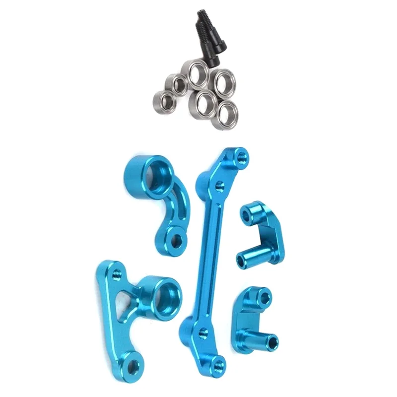 Kit de direction RC Tamiya M05 M06 installé sur châssis, montrant les liaisons et supports bleus.
