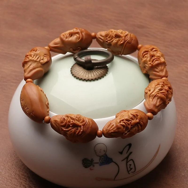 

Olive Nut Hand Carved Seven-Star Bracelet Stone Arhat Three-Dimensional Carving Handheld