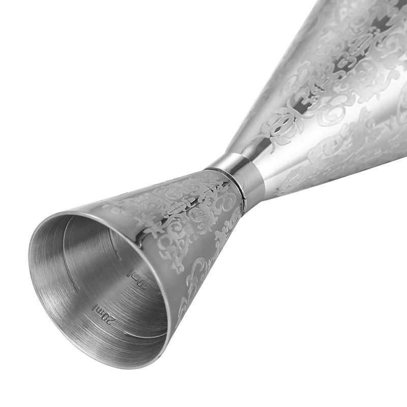 Assorted stainless steel cocktail jiggers for precise drink measurement in different sizes and finishes