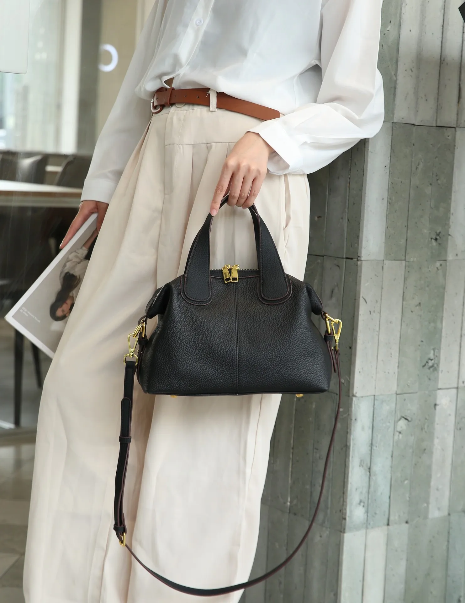 Elegant genuine leather crossbody handbag with shoulder strap and quality details