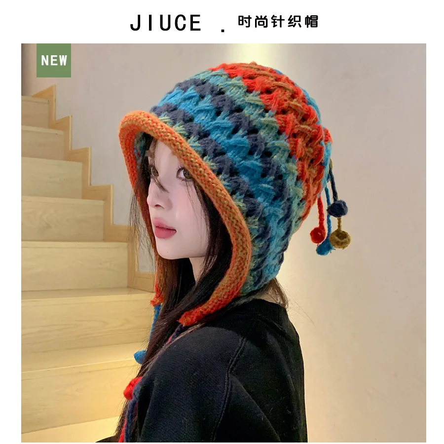 

Japanese niche handmade knitted hat, Korean colored tassel wool ball hanging rope wool hat, mesh red ear protection warm hat